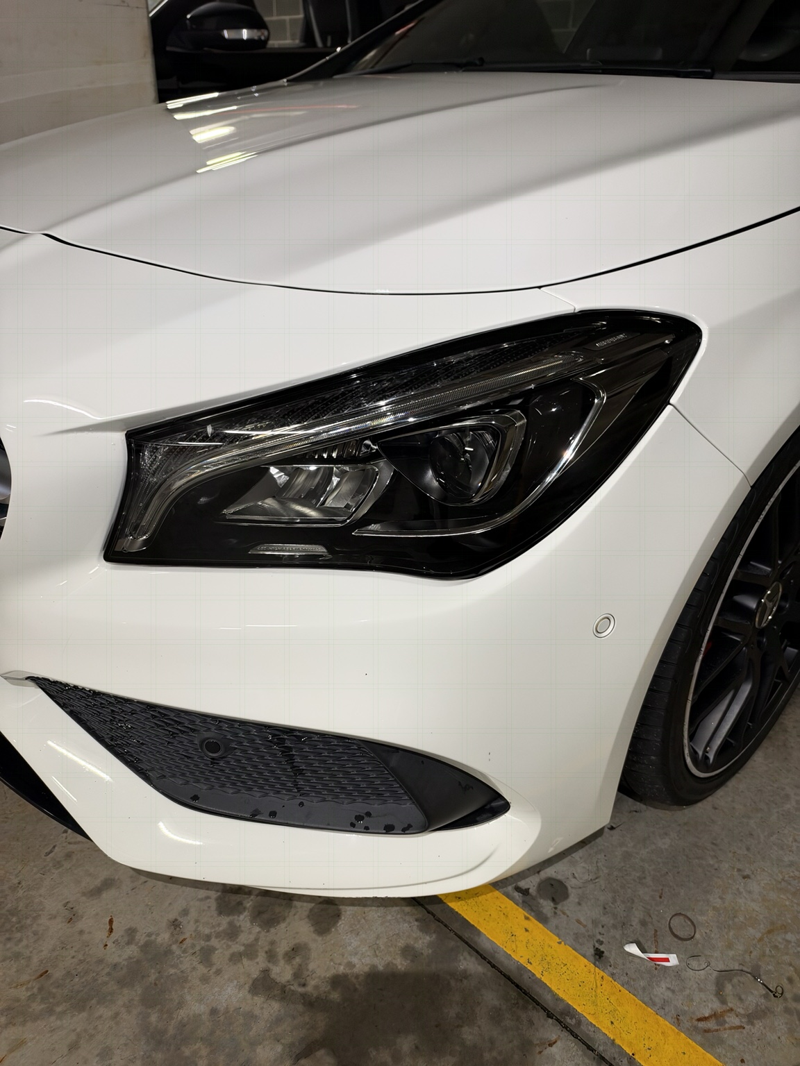 After — CLA 250 · Smoked headlight PPF