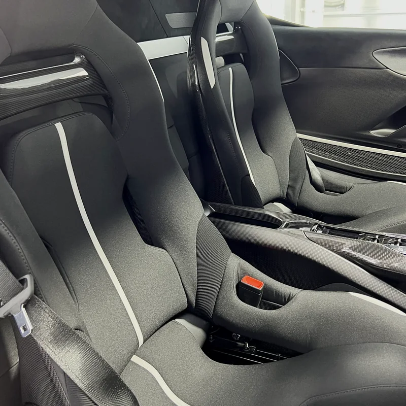 Protected Alcantara and leather seats inside a Ferrari after interior detailing