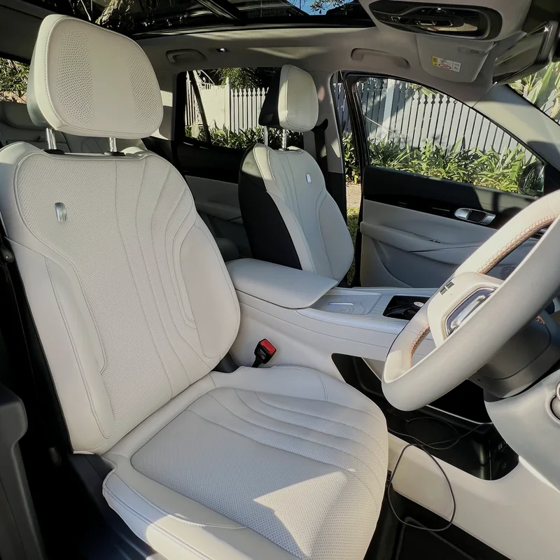 Light cream leather seats in an SUV after interior cleaning and protection