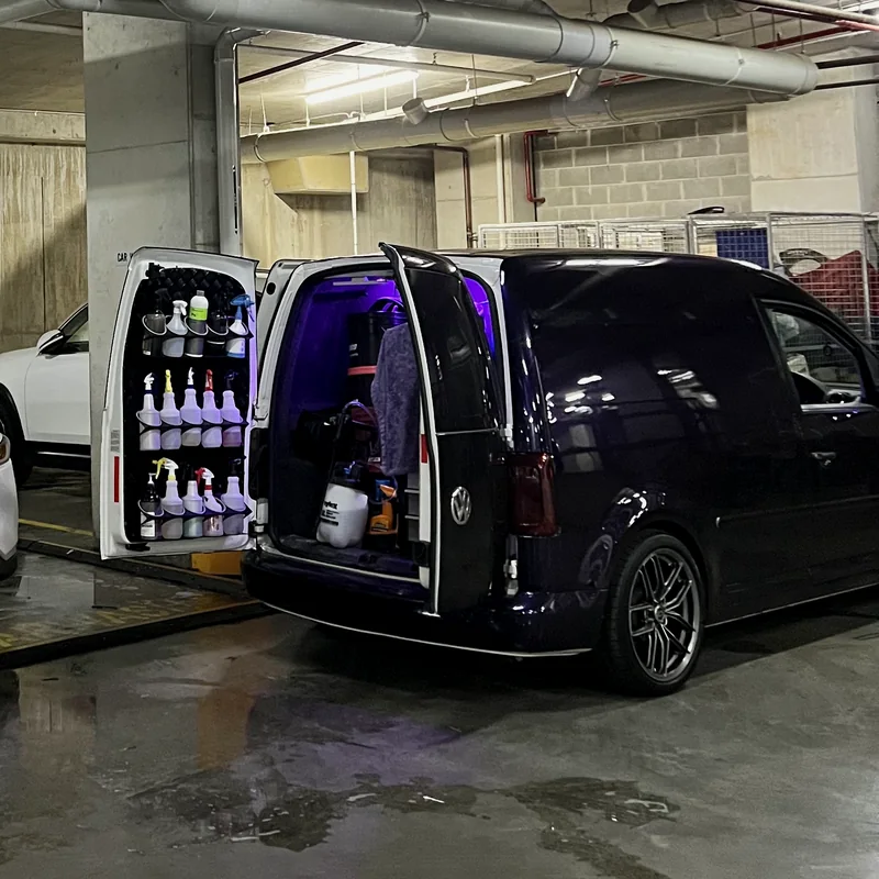 Need for Studio van with its rear doors open, showing the products and equipment carried to each job